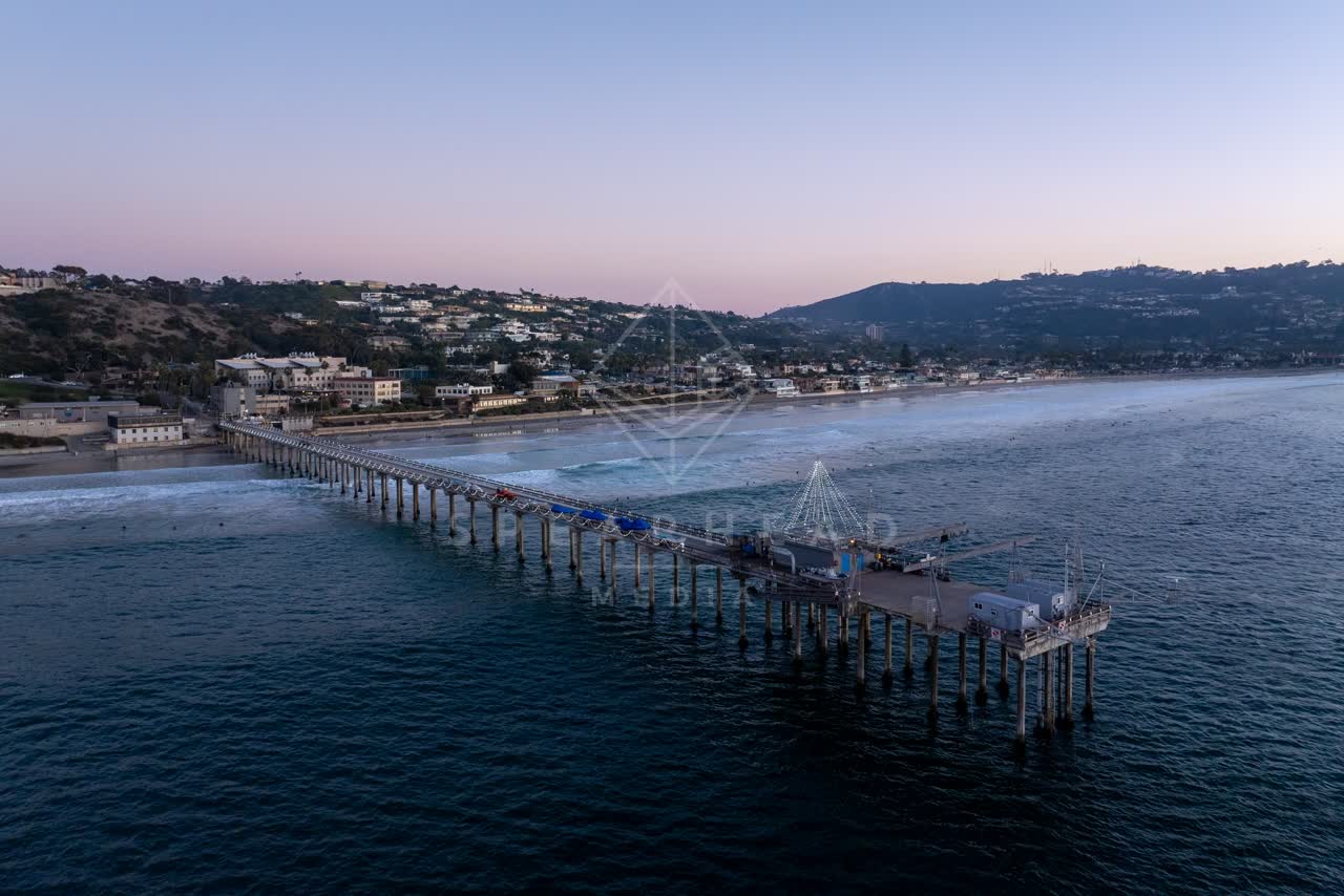 Aerial view of the beach, the pier and the ocean at La Jolla Shores.