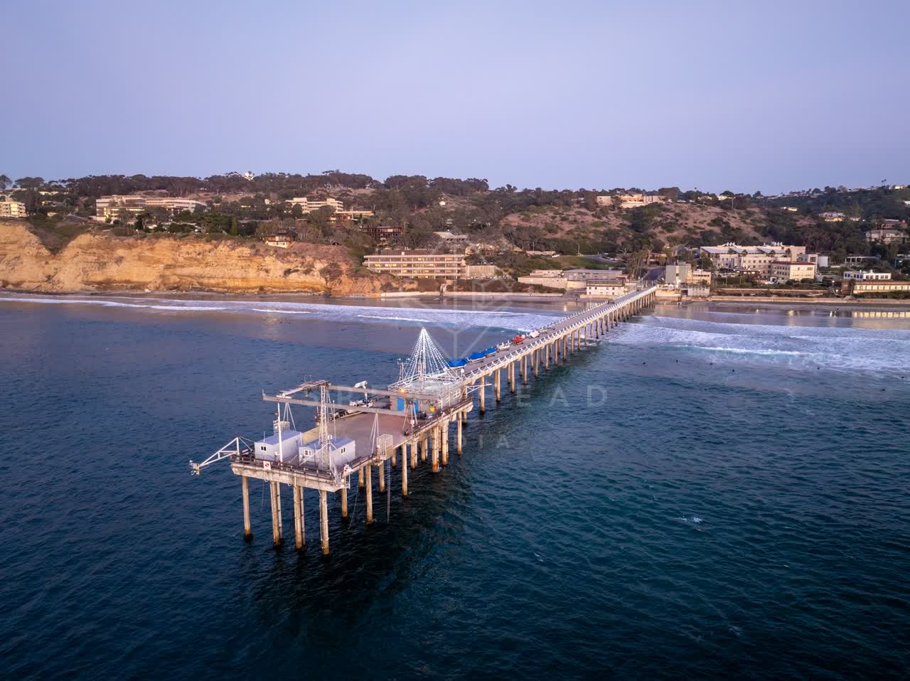 Aerial view of the beach, the pier and the ocean at La Jolla Shores.