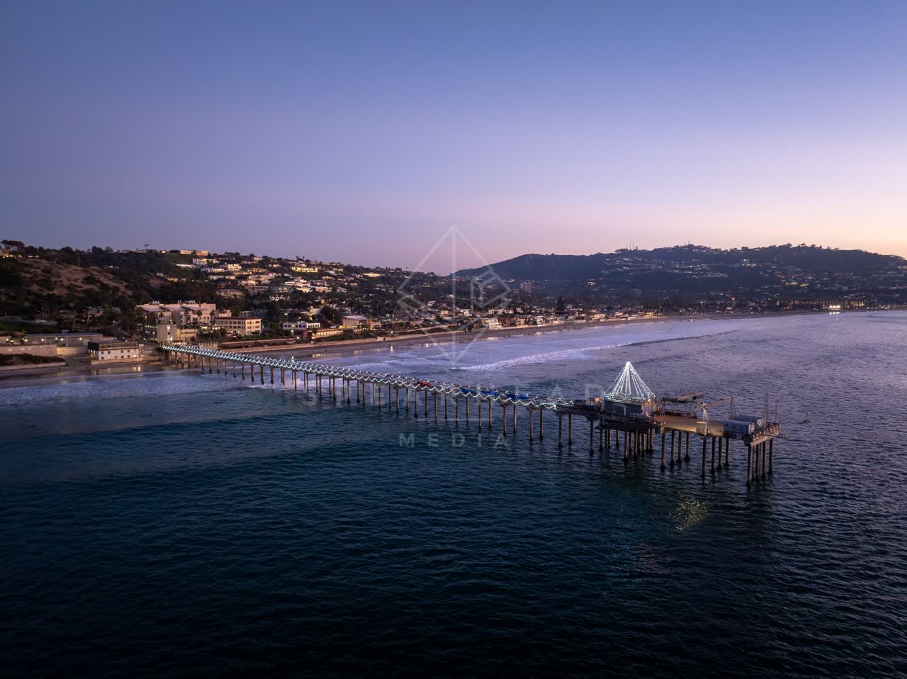 Aerial view of the beach, the pier and the ocean at La Jolla Shores.
