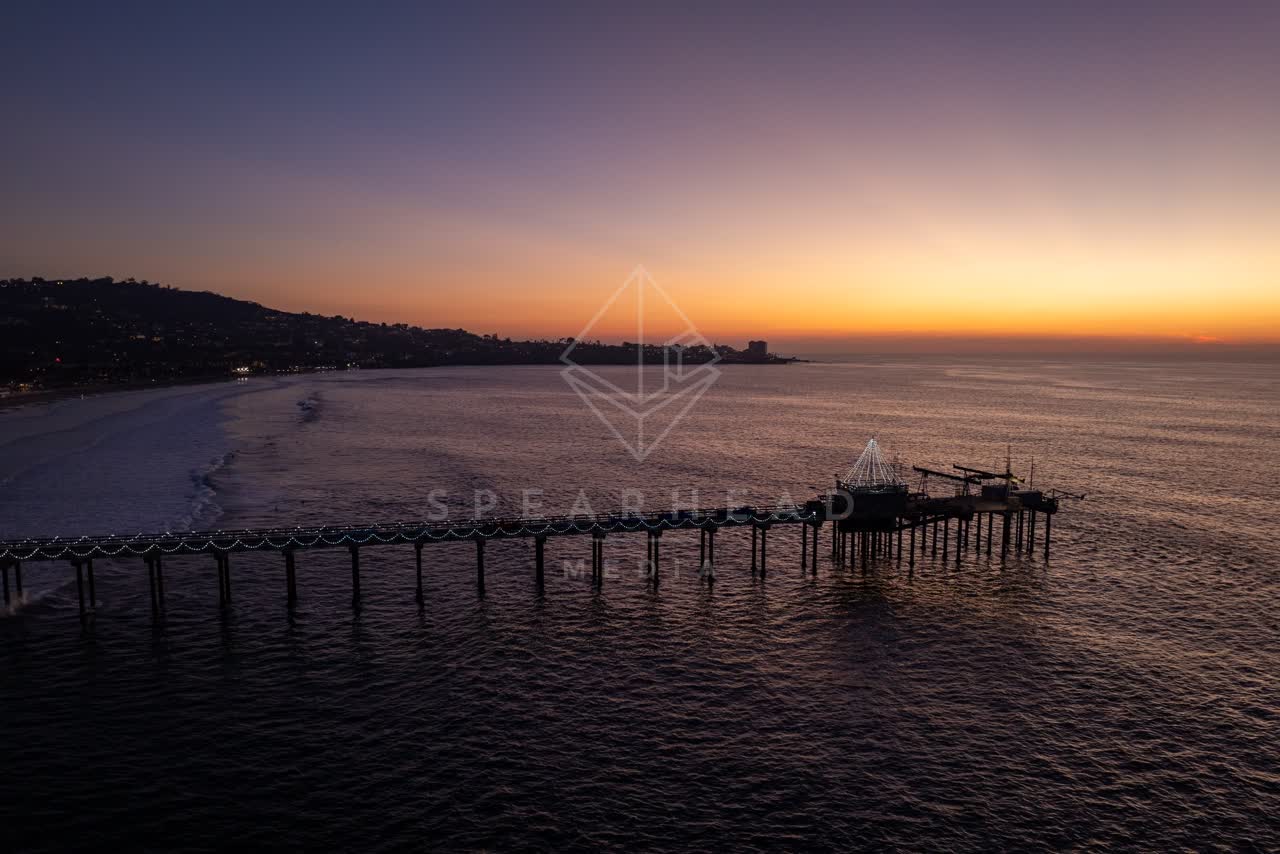 Aerial view of the beach, the pier and the ocean at La Jolla Shores.