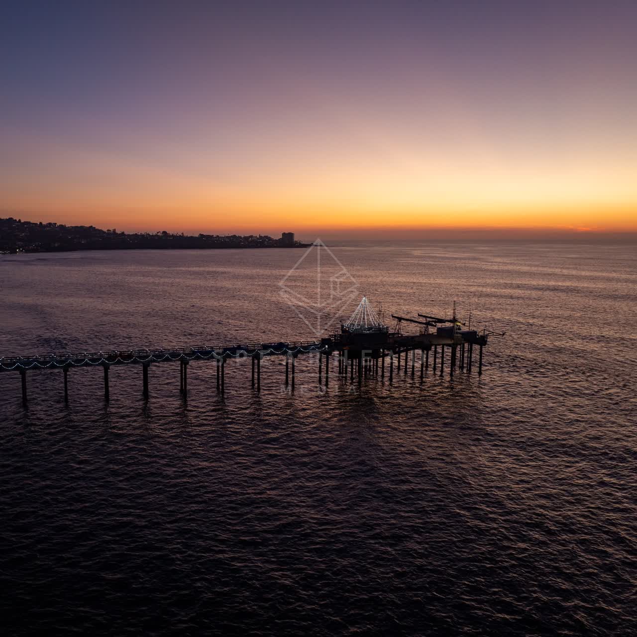 Aerial view of the beach, the pier and the ocean at La Jolla Shores.