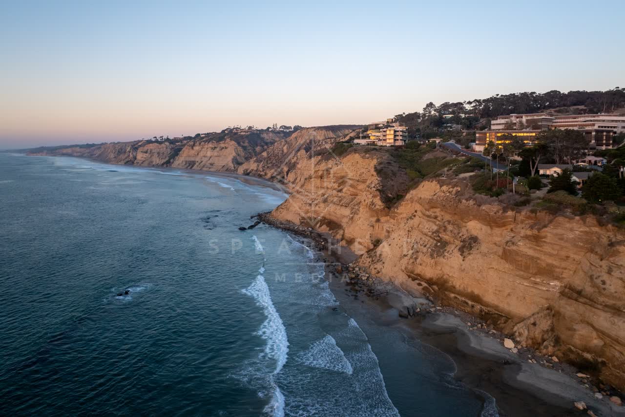 Aerial view of the cliffs, the ocean and homes at La Jolla Shores.