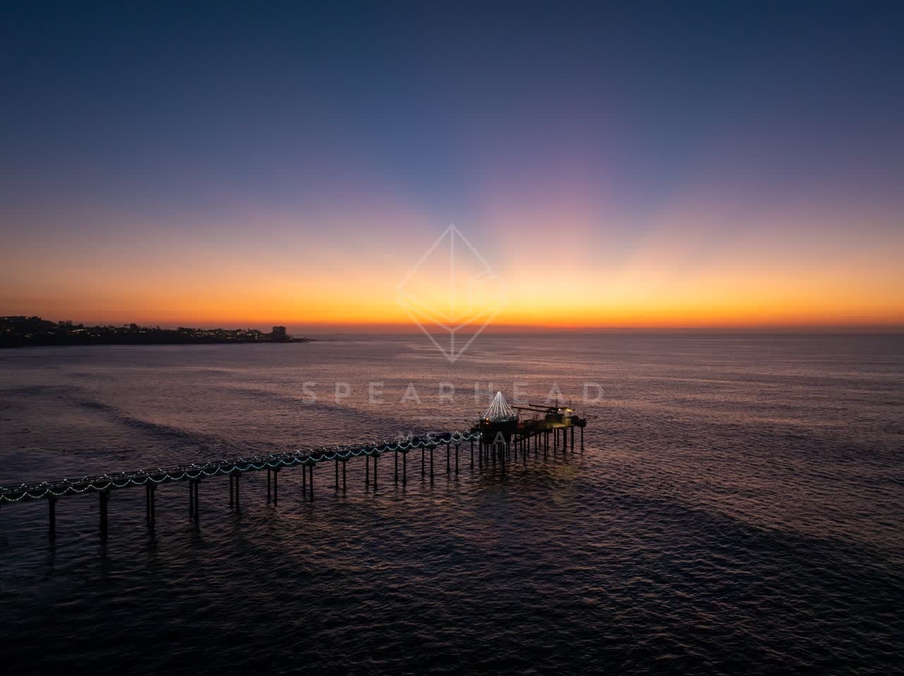 Aerial view of the beach, the pier and the ocean at La Jolla Shores.