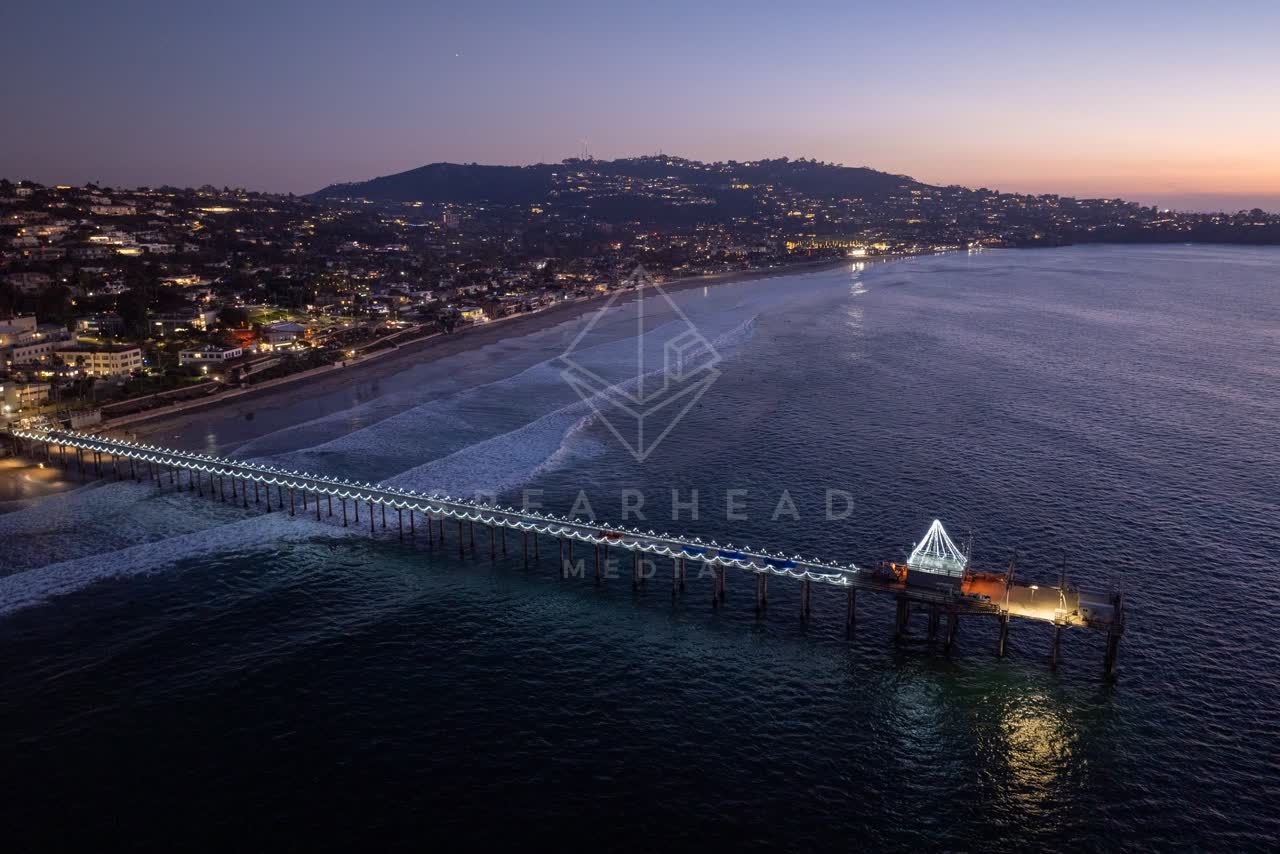 Aerial view of the beach, the pier and the ocean at La Jolla Shores.