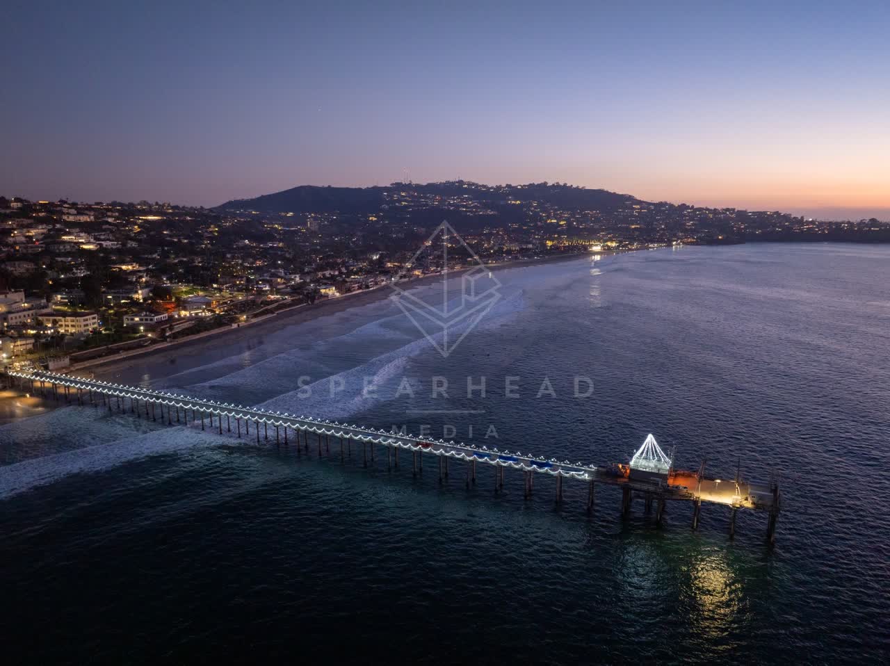 Aerial view of the beach, the pier and the ocean at La Jolla Shores.
