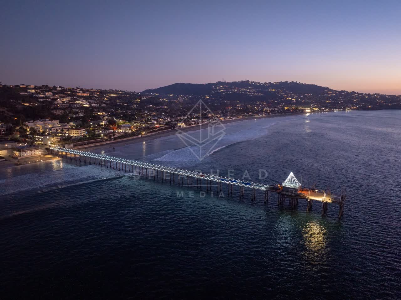 Aerial view of the beach, the pier and the ocean at La Jolla Shores.