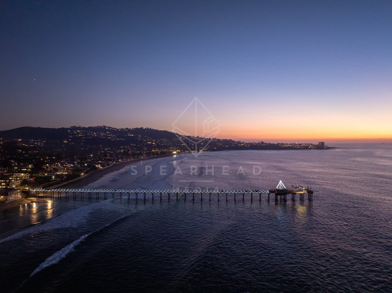 Aerial view of the beach, the pier and the ocean at La Jolla Shores.