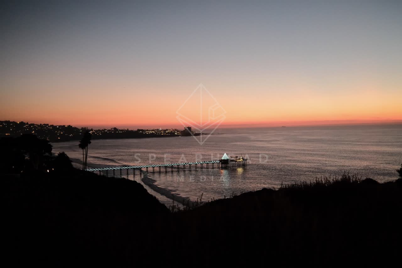 Elevated view of the cliffs, the pier and the ocean at La Jolla Shores.