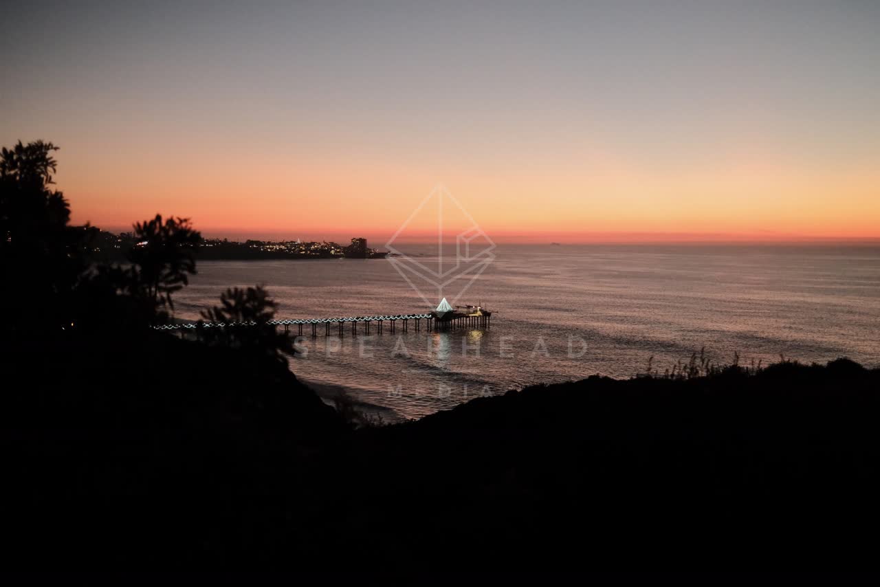 Elevated view of the cliffs, the pier and the ocean at La Jolla Shores.