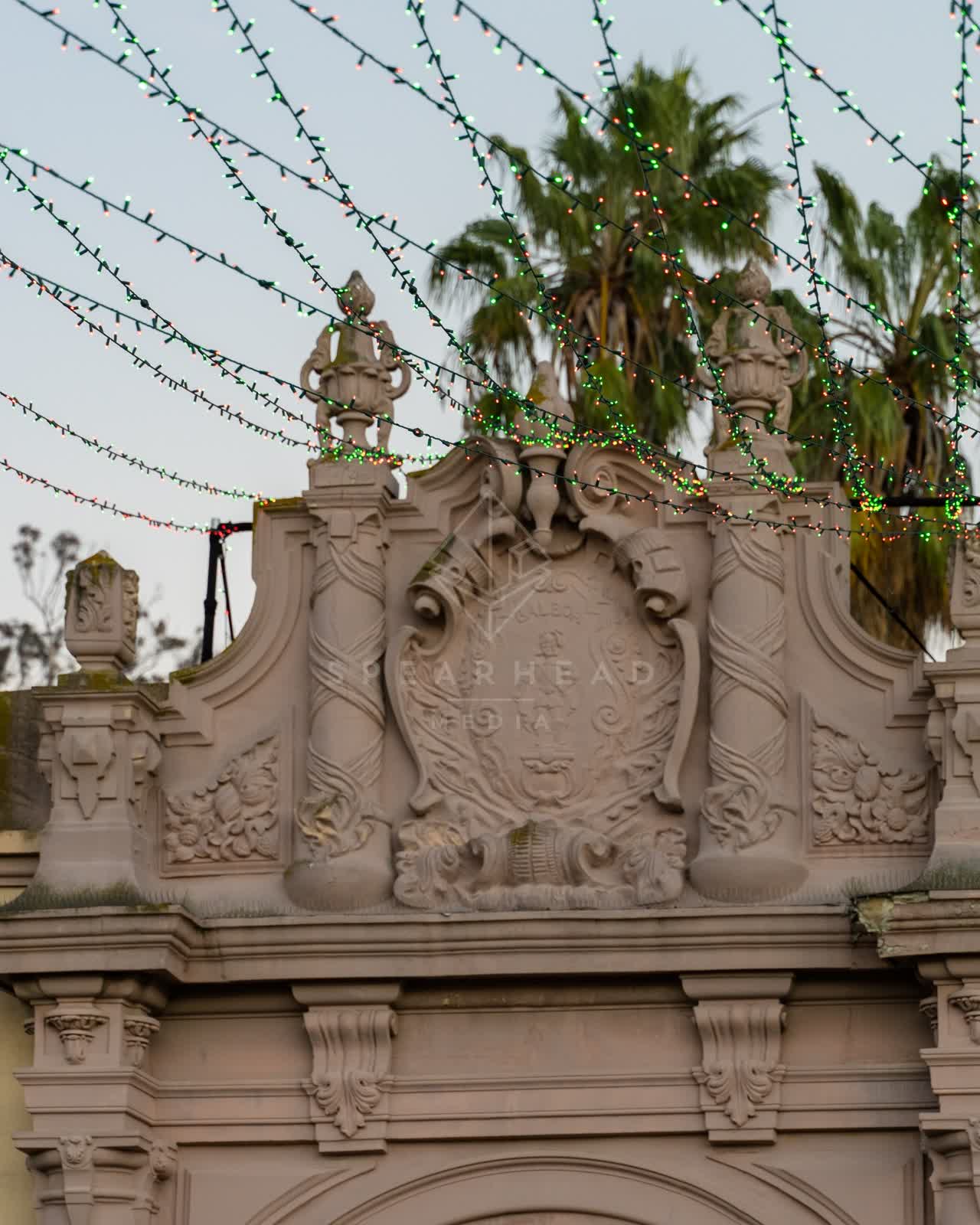 A park, palm trees and the buildings in Balboa Park.