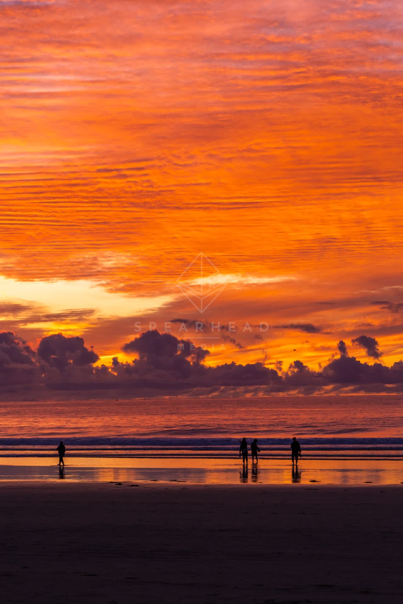 The beach, the ocean and open country at La Jolla Shores, with people walking.