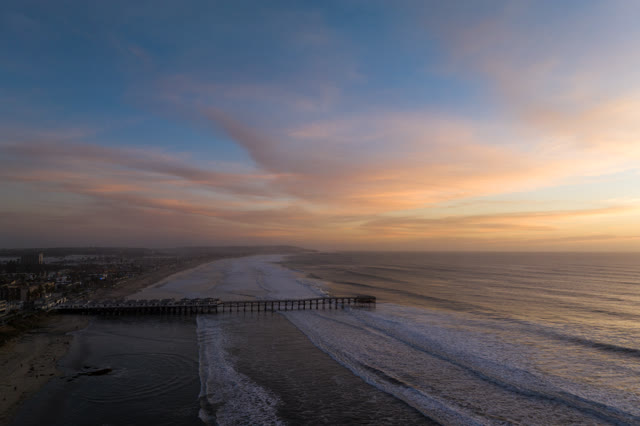 Aerial view of the beach, the surf and the pier in Pacific Beach.