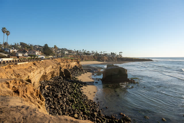 Elevated view of the cliffs, palm trees and the ocean at Sunset Cliffs.