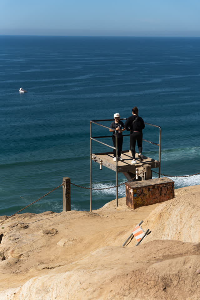 Elevated view of the cliffs, boats and the ocean at Torrey Pines.