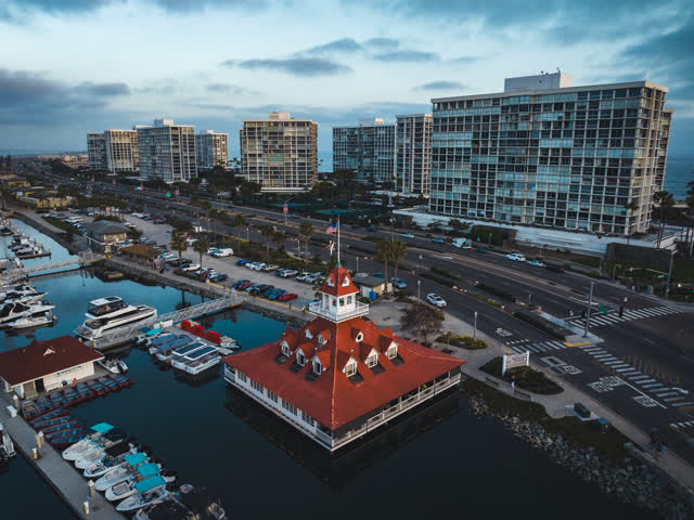 Aerial view of the harbor, boats and the bay at Coronado Beach, with boats out.