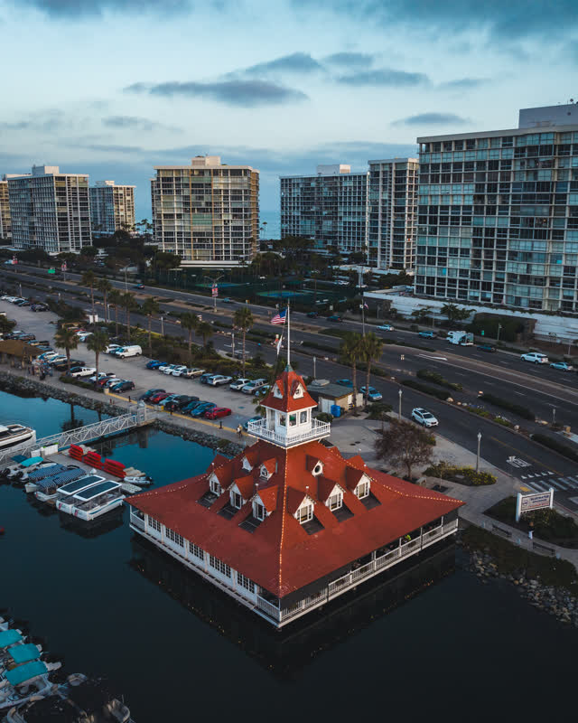 Aerial view of the harbor, boats and palm trees at Coronado Beach.