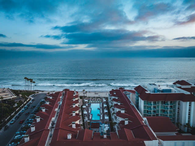 Aerial view of the beach, the surf and the pier at Coronado Beach.