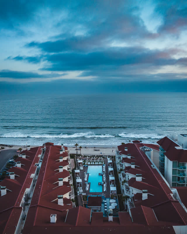 Aerial view of the beach, the surf and the ocean at Coronado Beach.