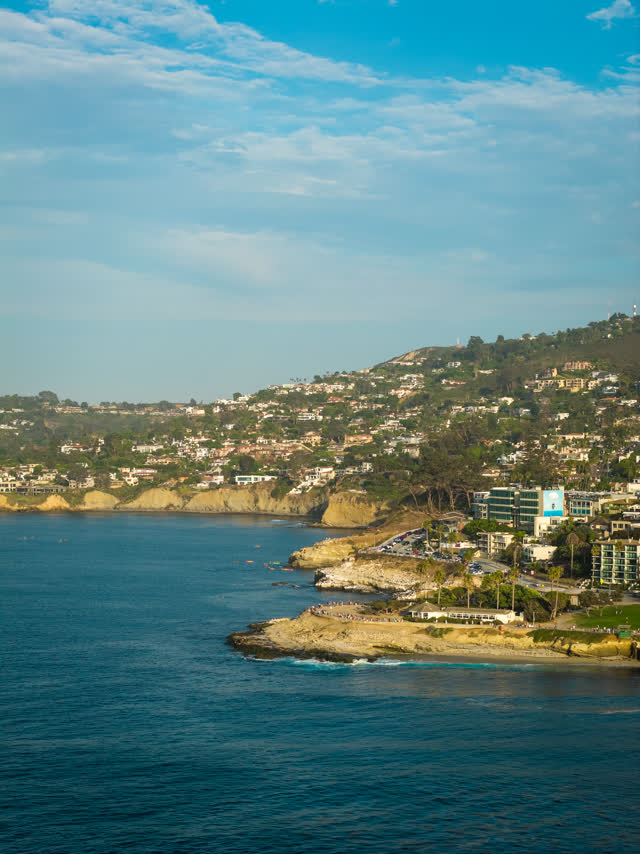 Aerial view of the cliffs, the ocean and homes at La Jolla Cove.