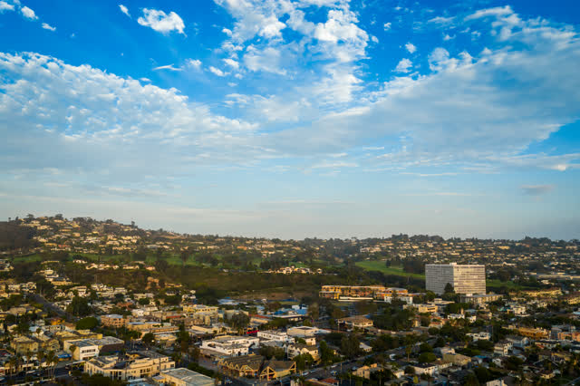 Aerial view of a residential street, homes and the buildings at La Jolla Cove.