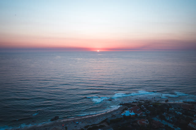 Aerial view of the beach, the surf and the ocean at Windansea.