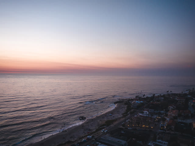 Aerial view of the cliffs, the ocean and homes at Windansea.