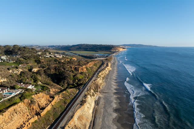 Aerial view of the cliffs, the ocean and homes in Del Mar.