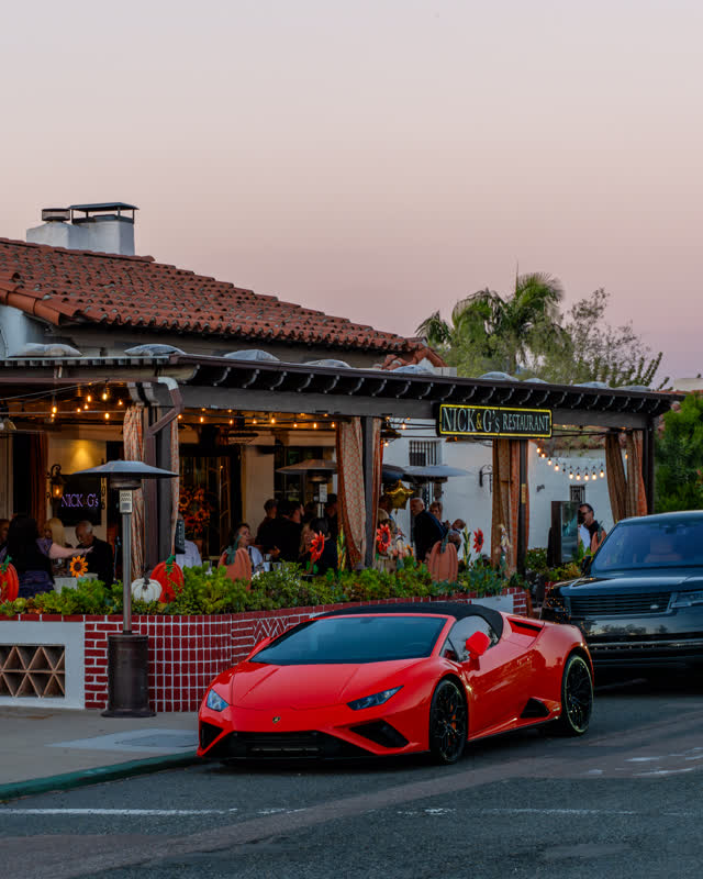 The downtown streets, palm trees and homes at Covenant, with people eating outside.