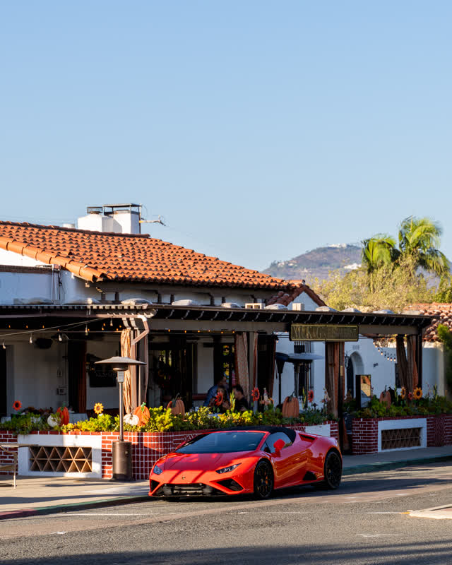 The downtown streets, palm trees and homes at Covenant, with people eating outside.