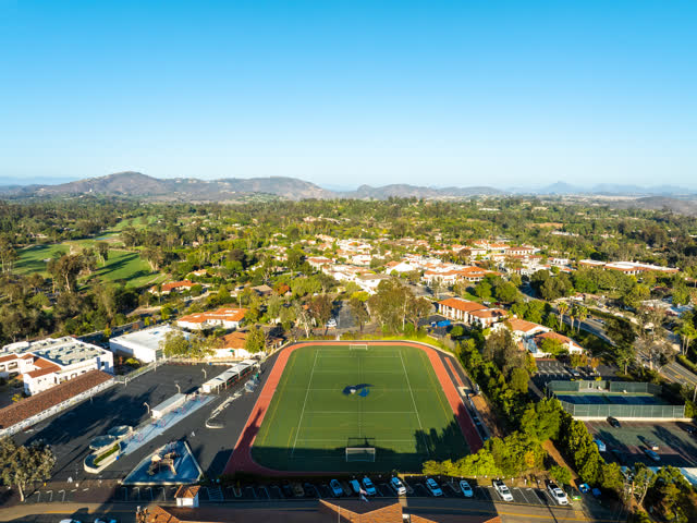 Aerial view of a residential street, homes and the buildings at Covenant.
