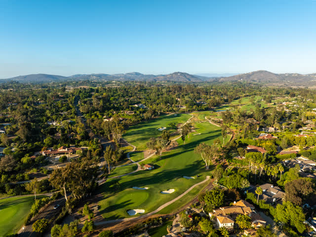 Aerial view of the country inland, palm trees and homes at Covenant.
