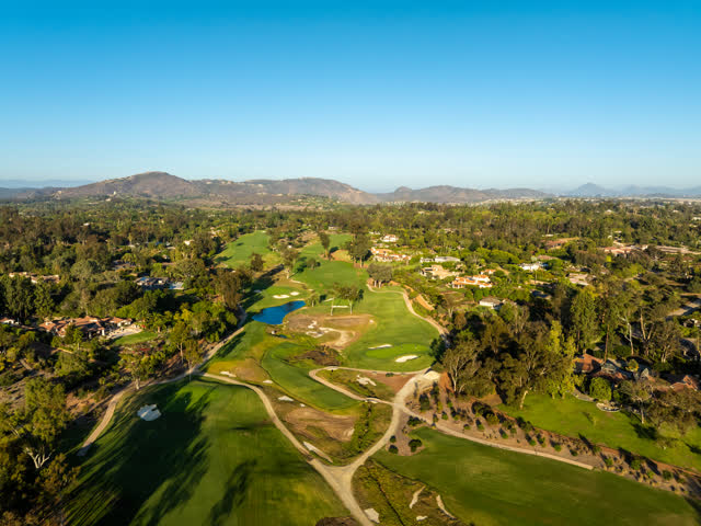 Aerial view of the country inland, palm trees and homes at Covenant.