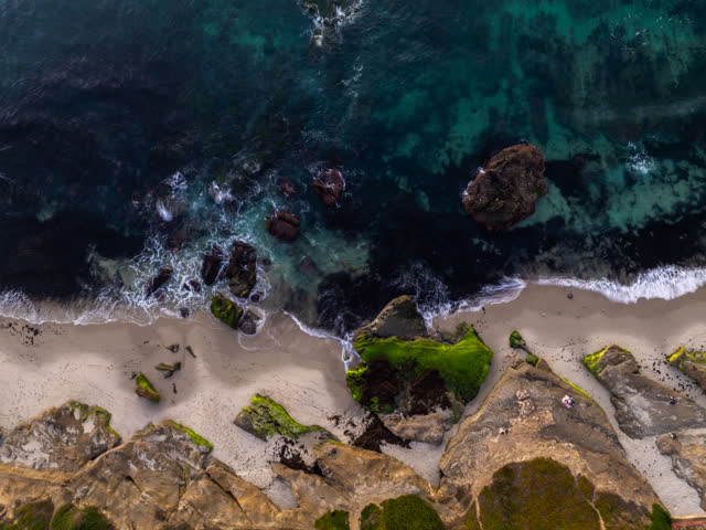 Aerial view of the beach, the surf and the ocean at Windansea.