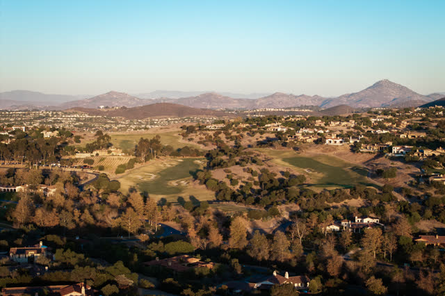 Aerial view of the country inland, homes and open country in Santaluz.