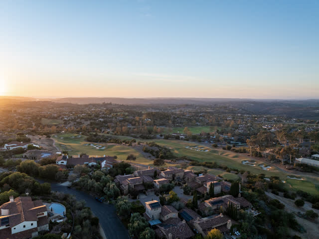 Aerial view of a residential street, homes and the buildings in Santaluz.