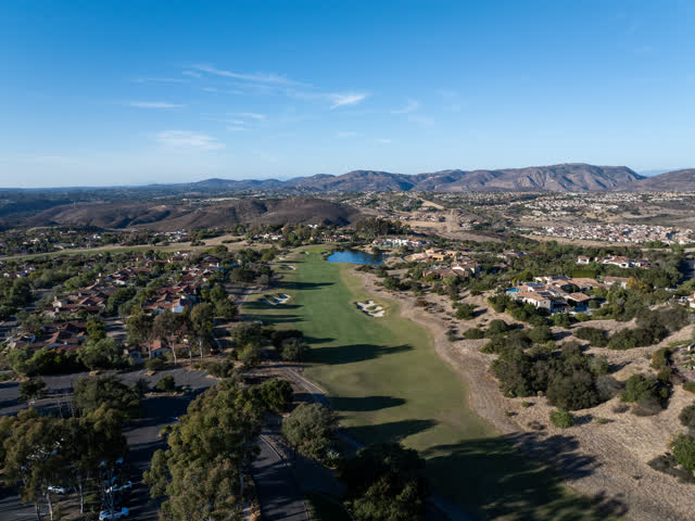Aerial view of the country inland, homes and open country in Santaluz.