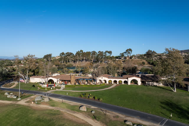 Low aerial view of the country inland, the buildings and traffic in Santaluz.