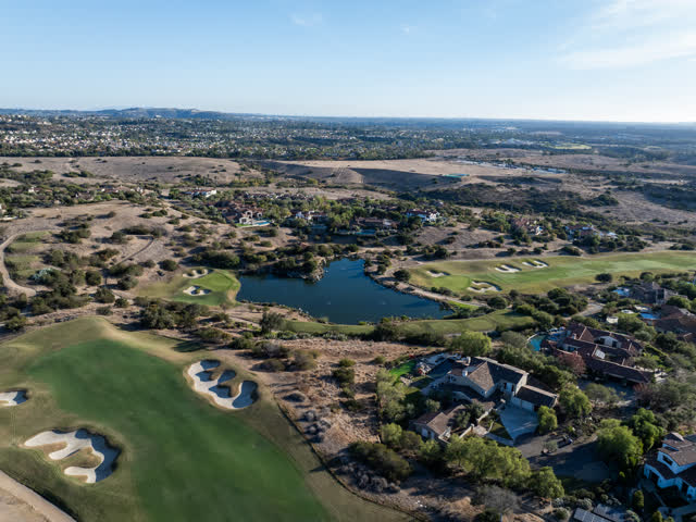 Aerial view of the country inland, homes and open country in Santaluz.
