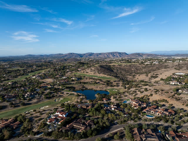 Aerial view of the country inland, homes and open country in Santaluz.