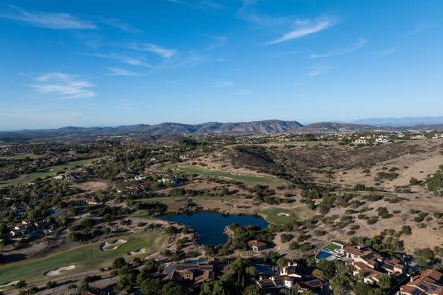 Aerial view of the country inland, homes and open country in Santaluz.