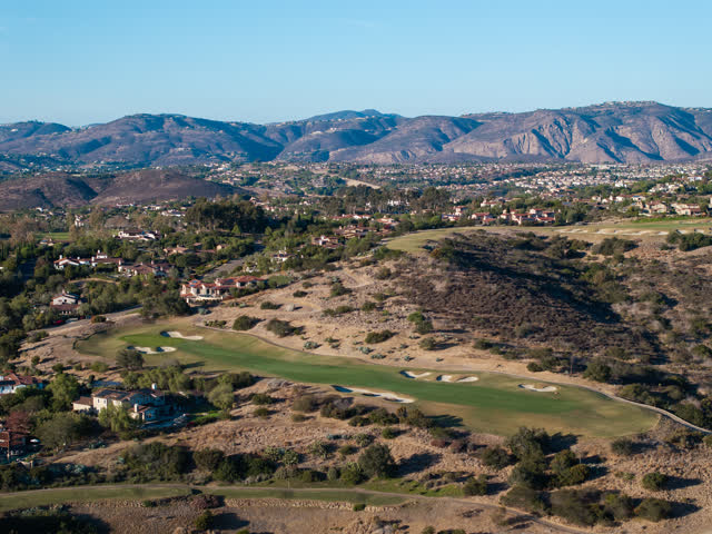 Aerial view of the country inland, homes and the buildings in Santaluz.