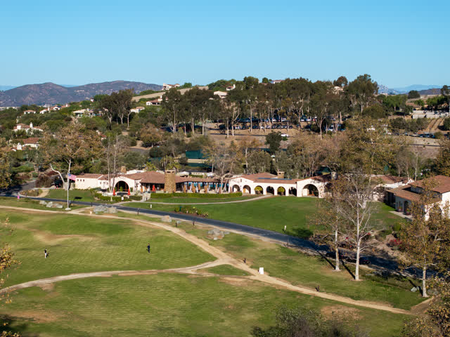 Aerial view of the country inland, homes and the buildings in Santaluz, with people walking.