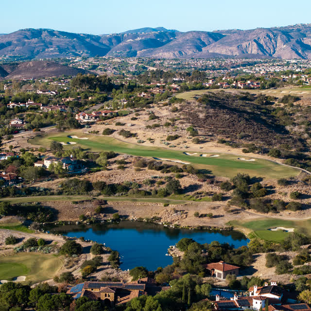 Aerial view of the country inland, homes and open country in Santaluz.