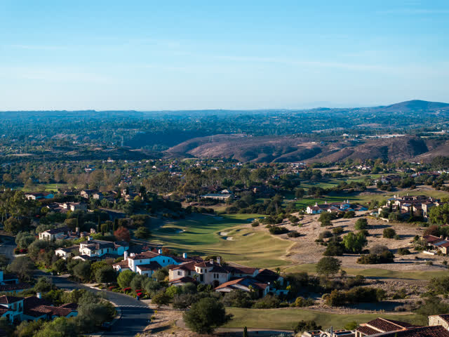 Aerial view of a residential street, homes and the buildings in Santaluz.
