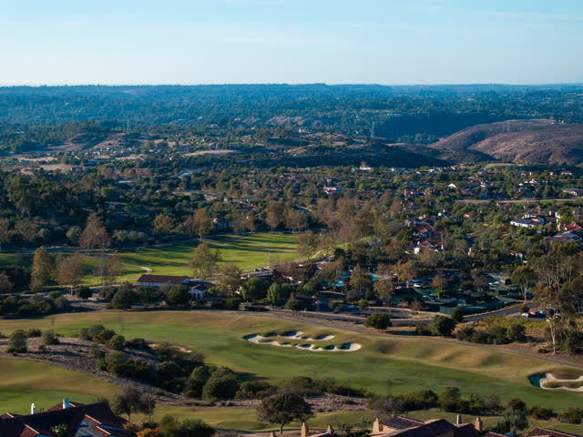 Aerial view of the country inland, homes and open country in Santaluz.