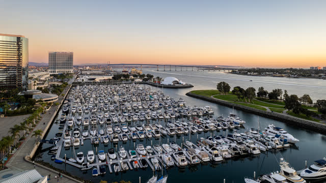 Aerial view of the harbor, the bridge and the skyline at San Diego Marina, with boats out.