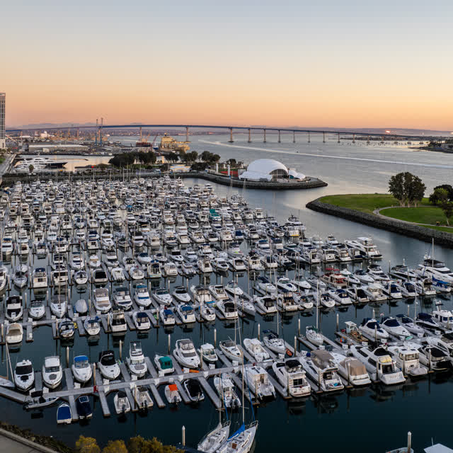 Aerial view of the harbor, the bridge and boats at San Diego Marina, with boats out.