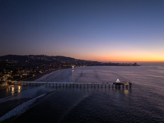 Aerial view of the beach, the pier and the ocean at La Jolla Shores.