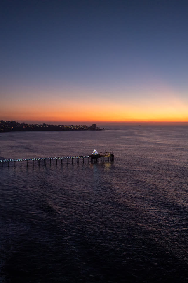 Aerial view of the beach, the pier and the ocean at La Jolla Shores.