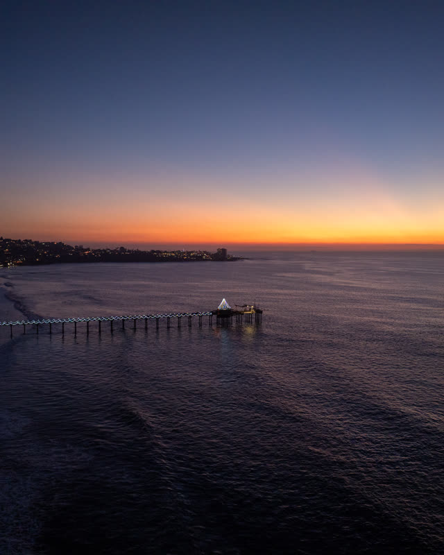 Aerial view of the beach, the pier and the ocean at La Jolla Shores.